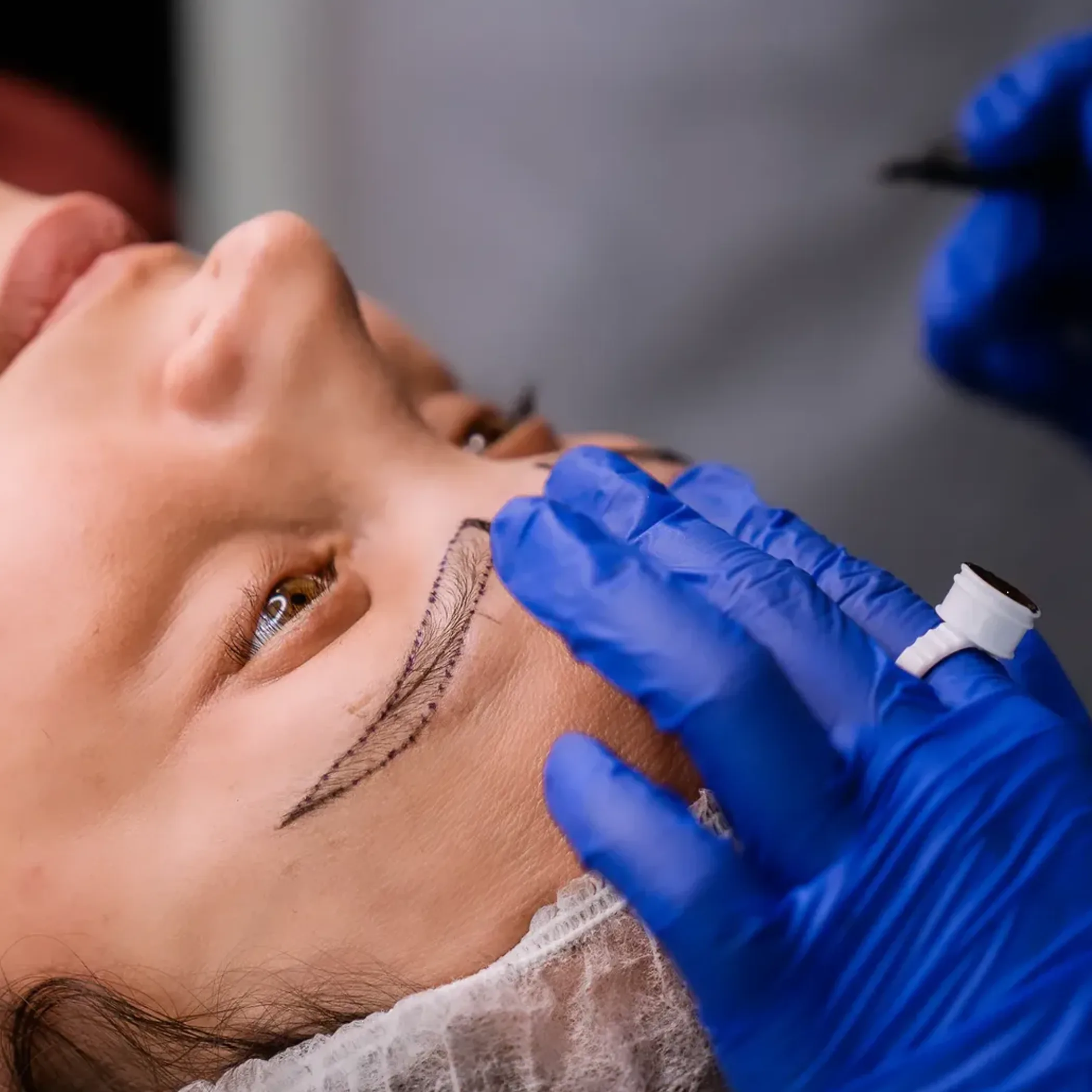 eyebrow permanent makeup application close-up