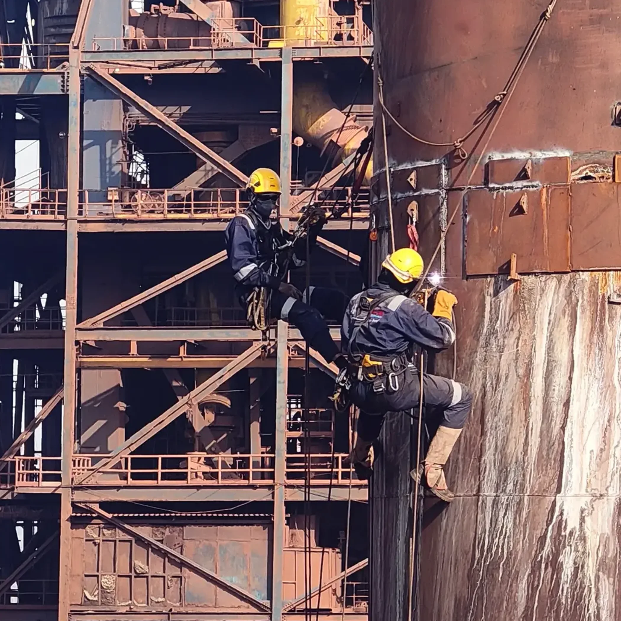 workers performing rope-access maintenance