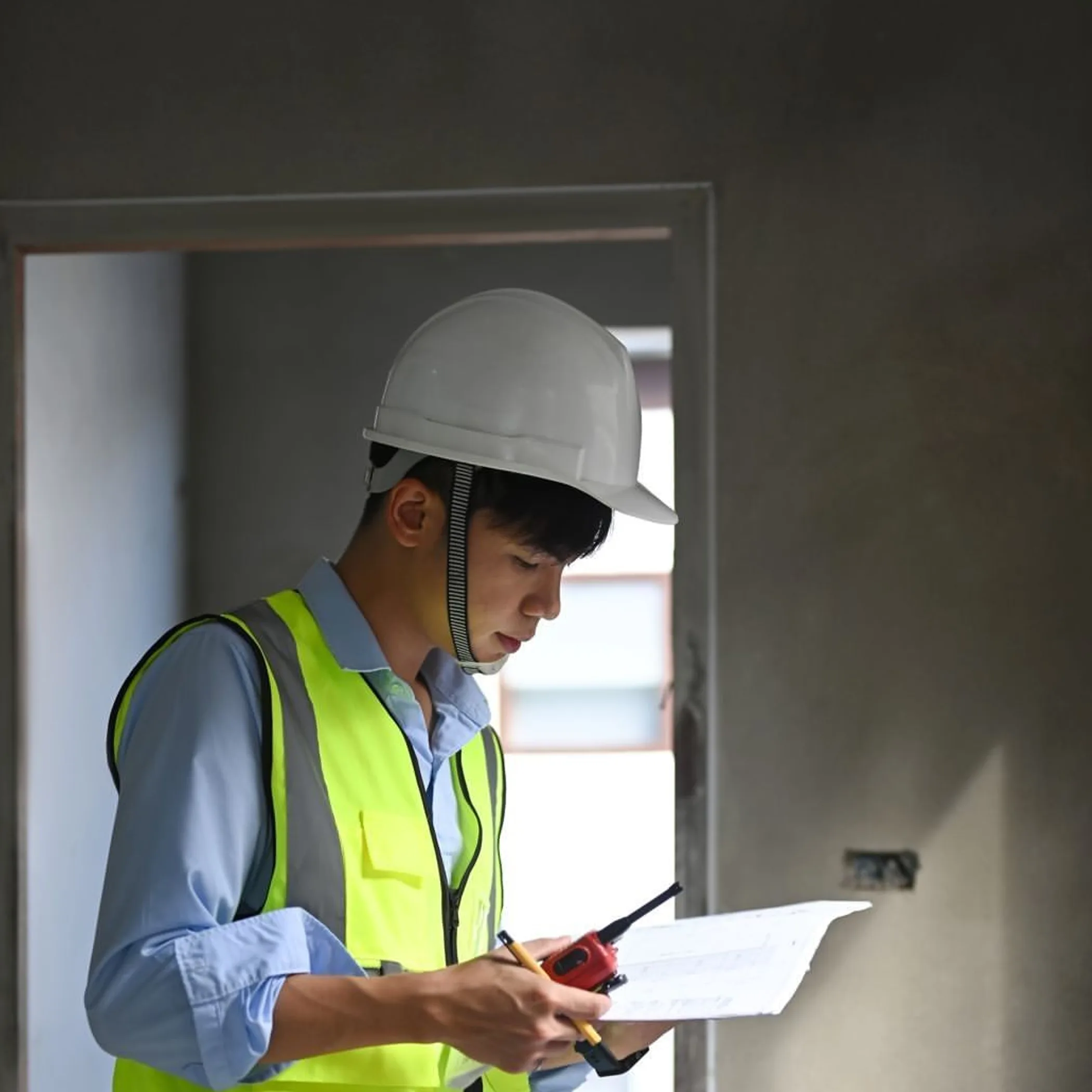 building inspector reviewing construction plans